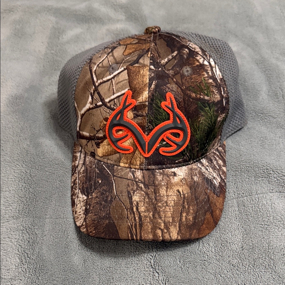 Realtree Camouflage Hat with Vibrant Orange Emblem